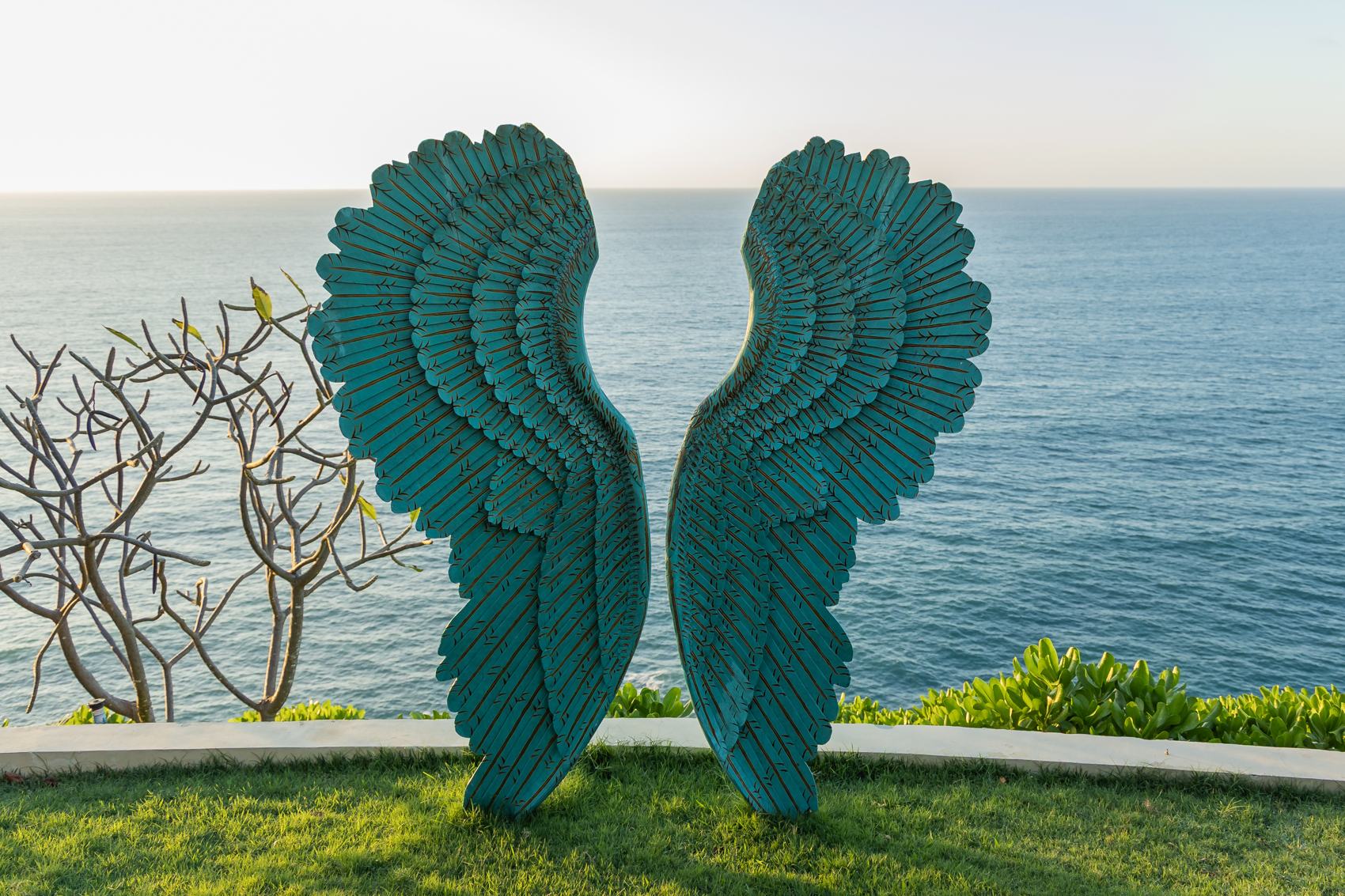 Angel wings sculpture over the ocean